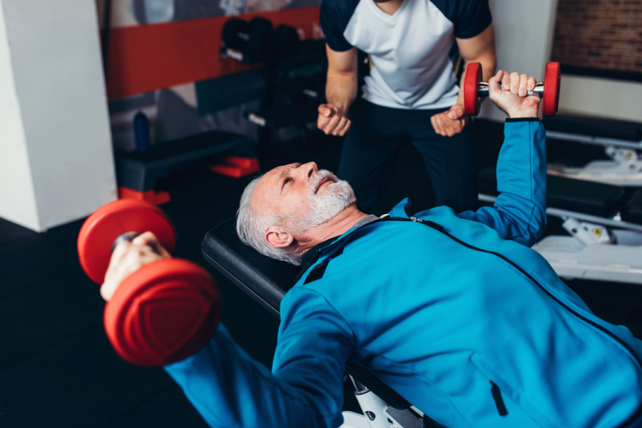 older adult lifting weights