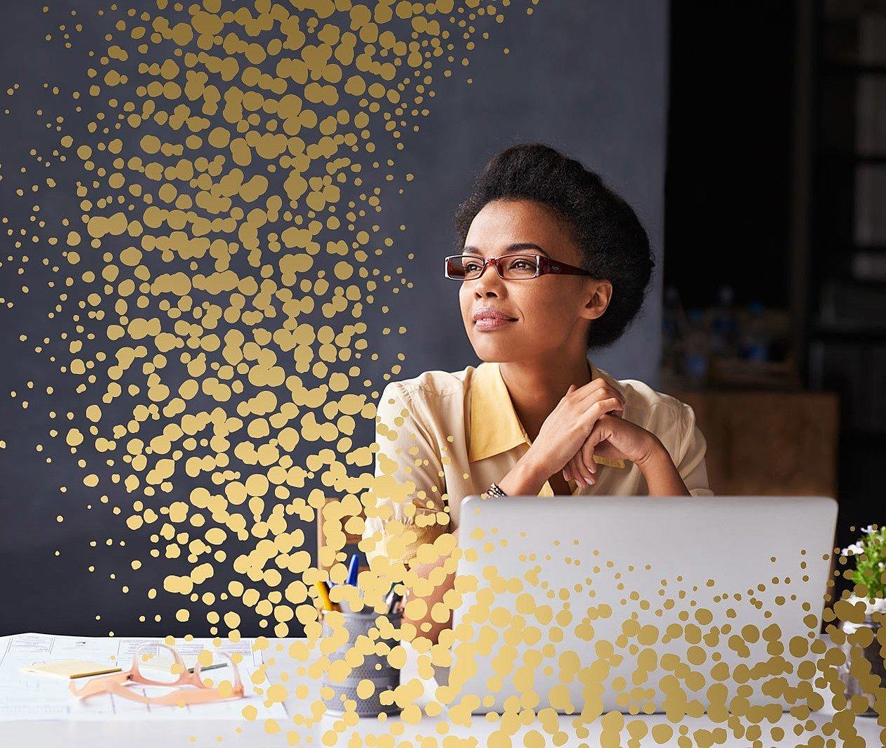 Woman sitting at work desk contemplating