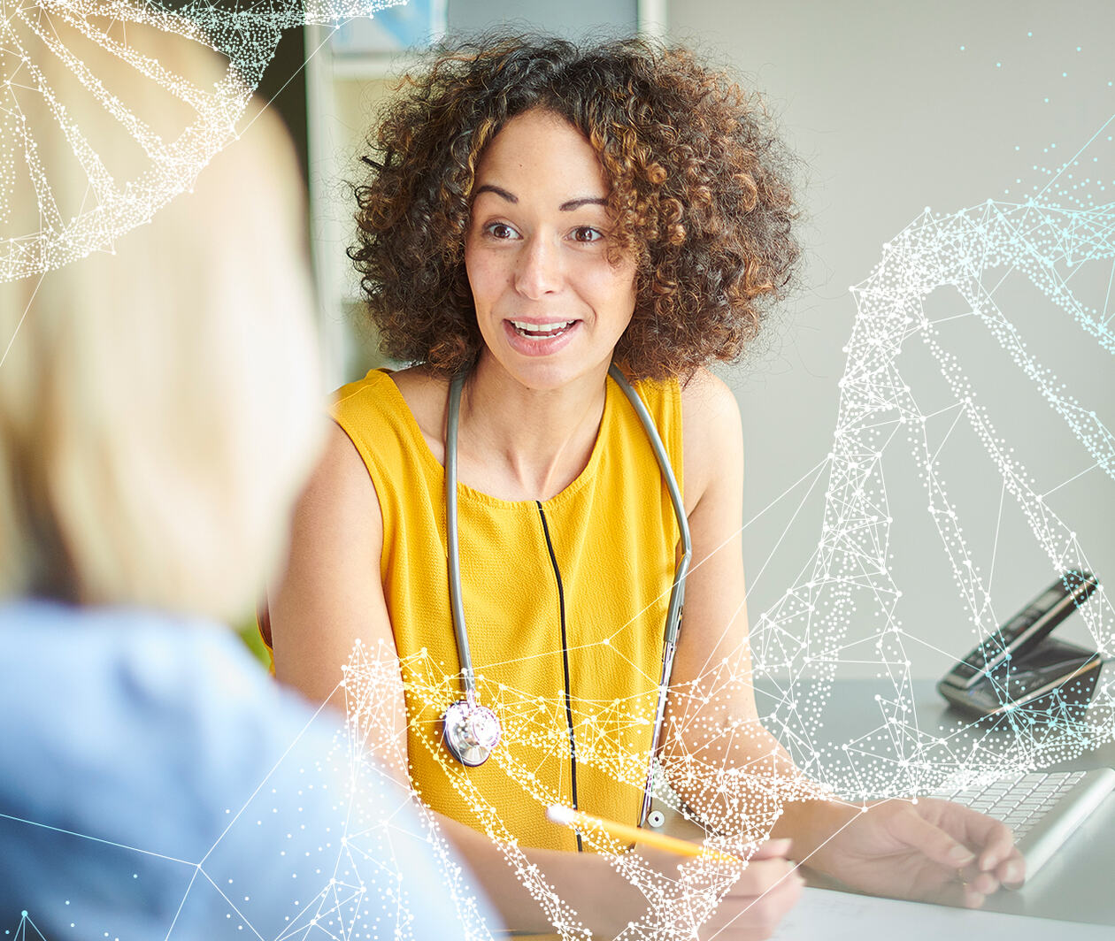 A female clinician in a yellow dress wearing a stethoscope speaks to a blonde female patient whose faced is obscured. A double helix is overlaid over the scene.