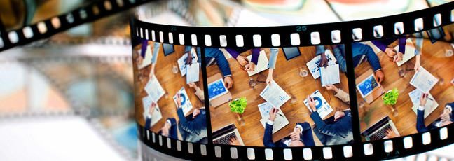 Film roll with image of people sharing business ideas around a table