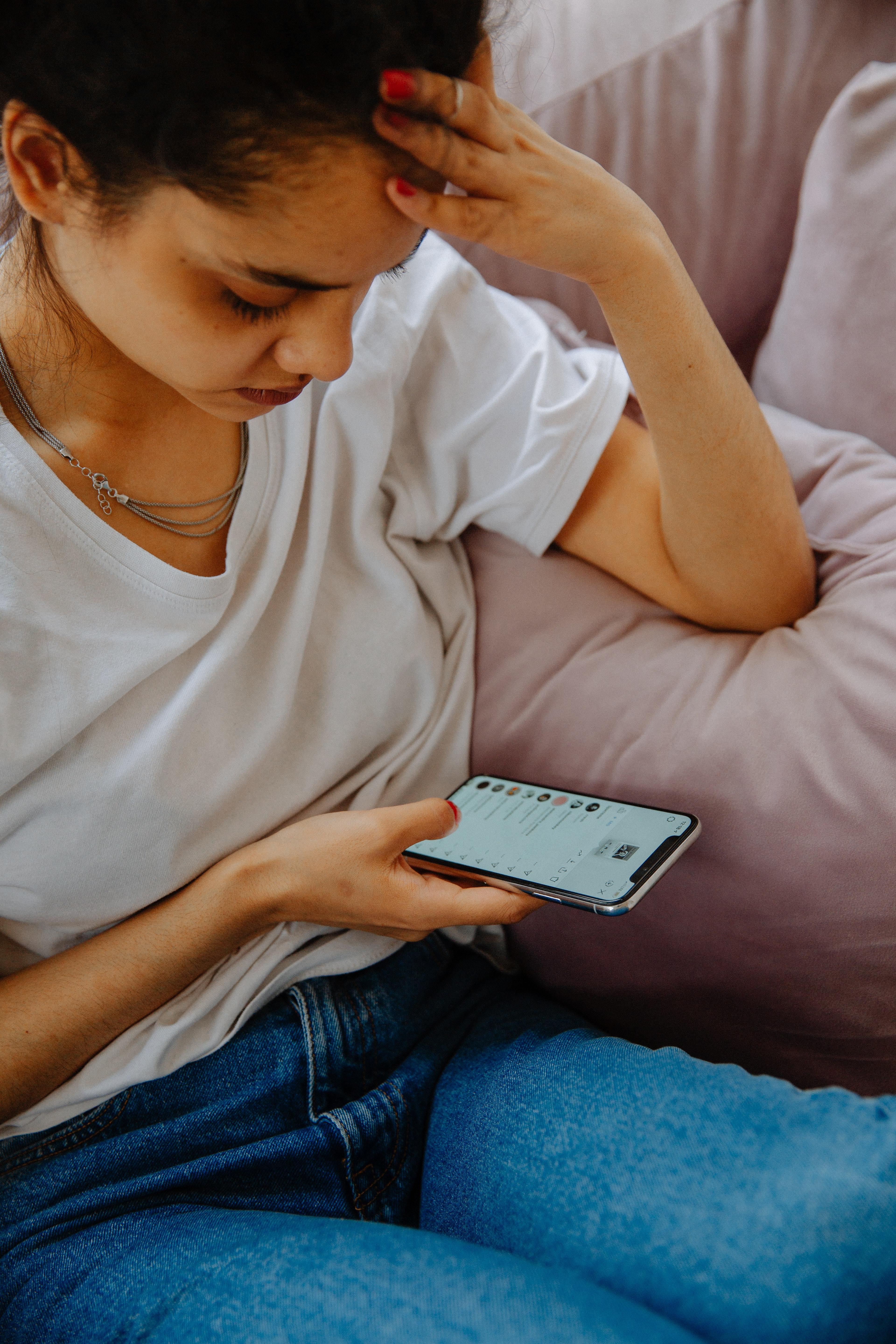 Young person looking at their phone