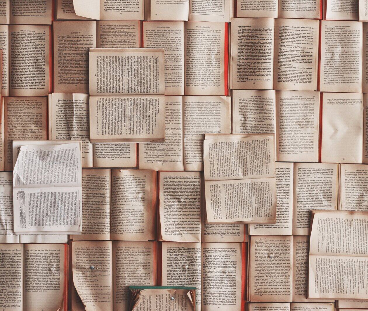 Overhead view of pages from books arranged geometrically