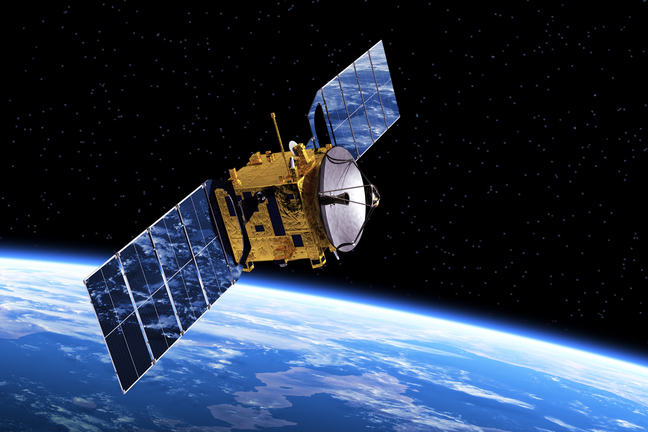 A small cube shaped satellite with solar panels extended