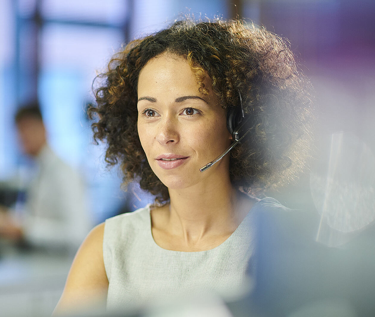 A woman wearing a headset.