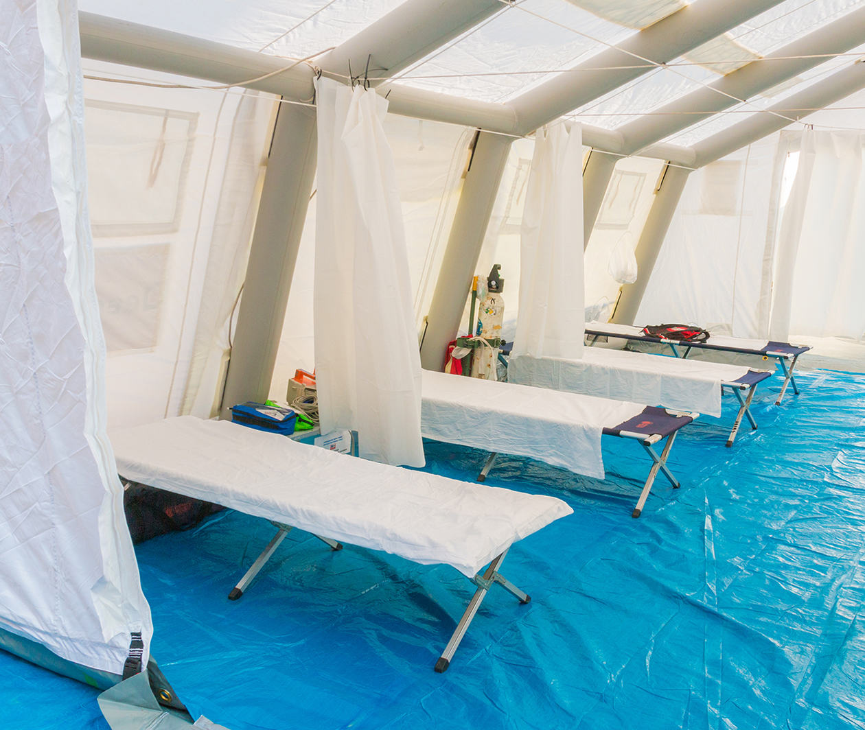 hospital beds in a tent 