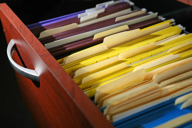 Filing cabinet full of files.