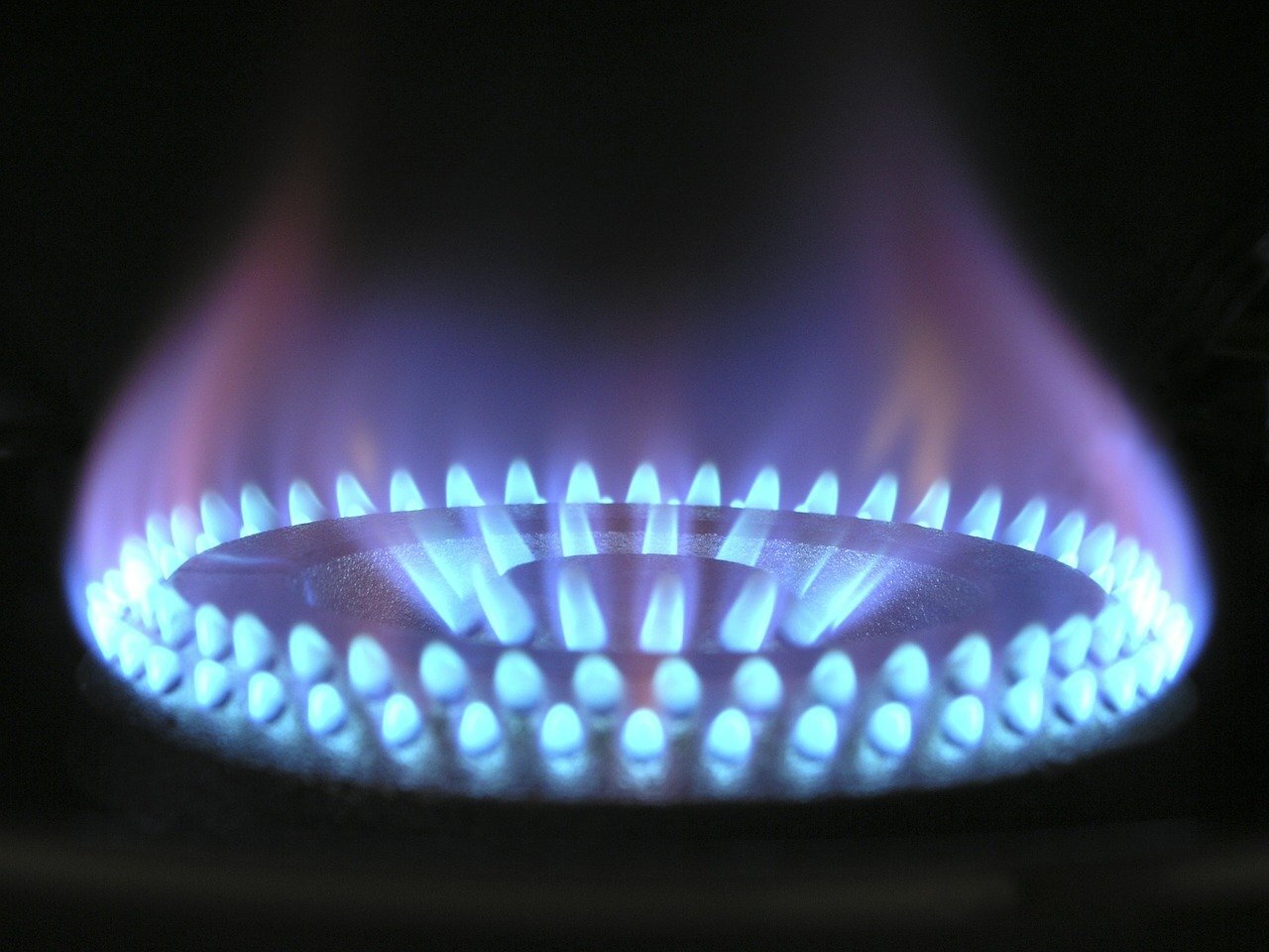 A lit up gas cooking ring