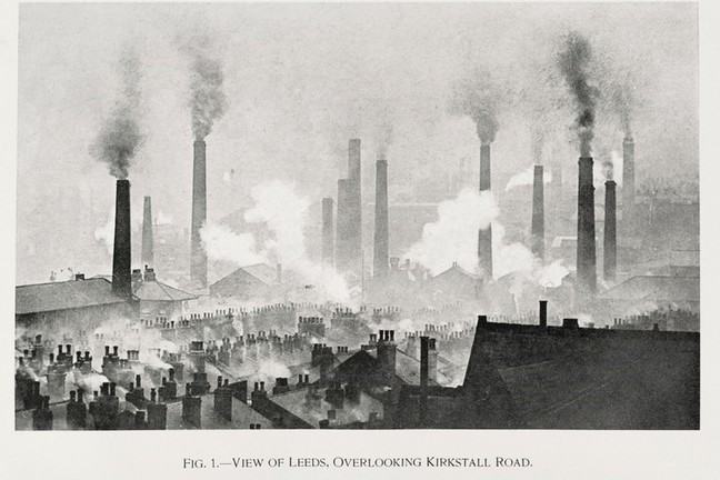 An old black and white painting of Leeds cityscape and rooftops with large industrial chimneys emitting smoke and domestic chimneys also emitting smoke