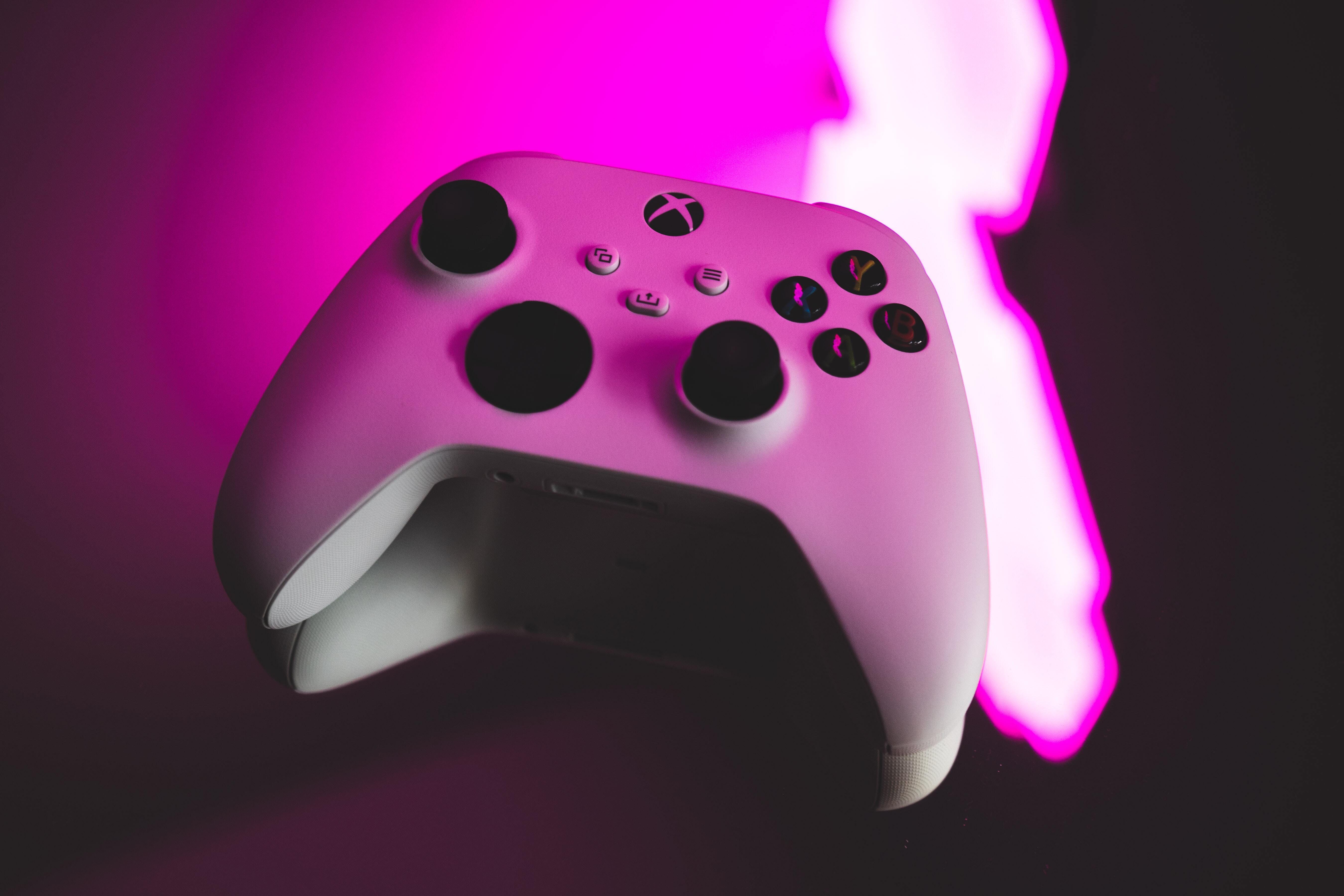 Gaming control with a pink and black background