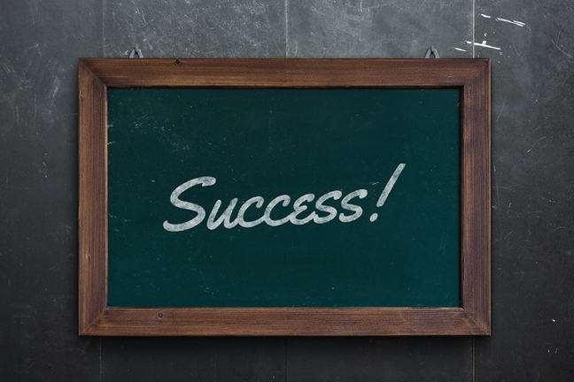 Success written on a green chalkboard