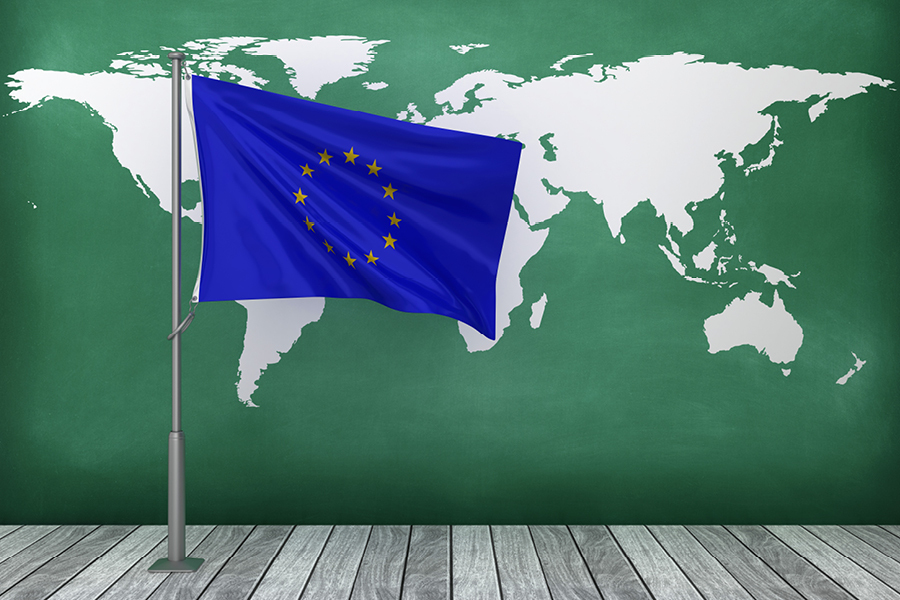 EU flag with chalkboard showing world map.