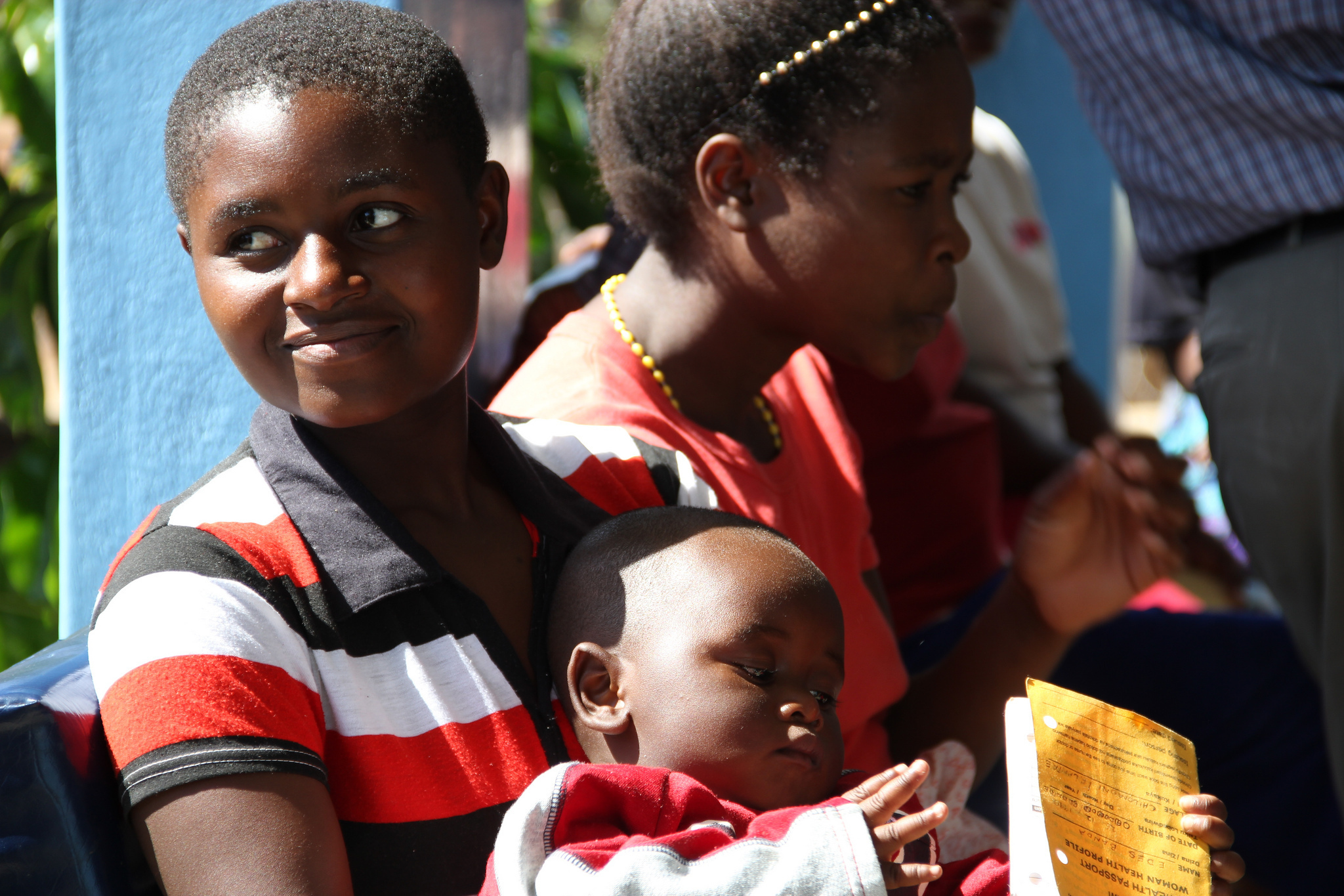 Image of mother and baby waiting for family planning services