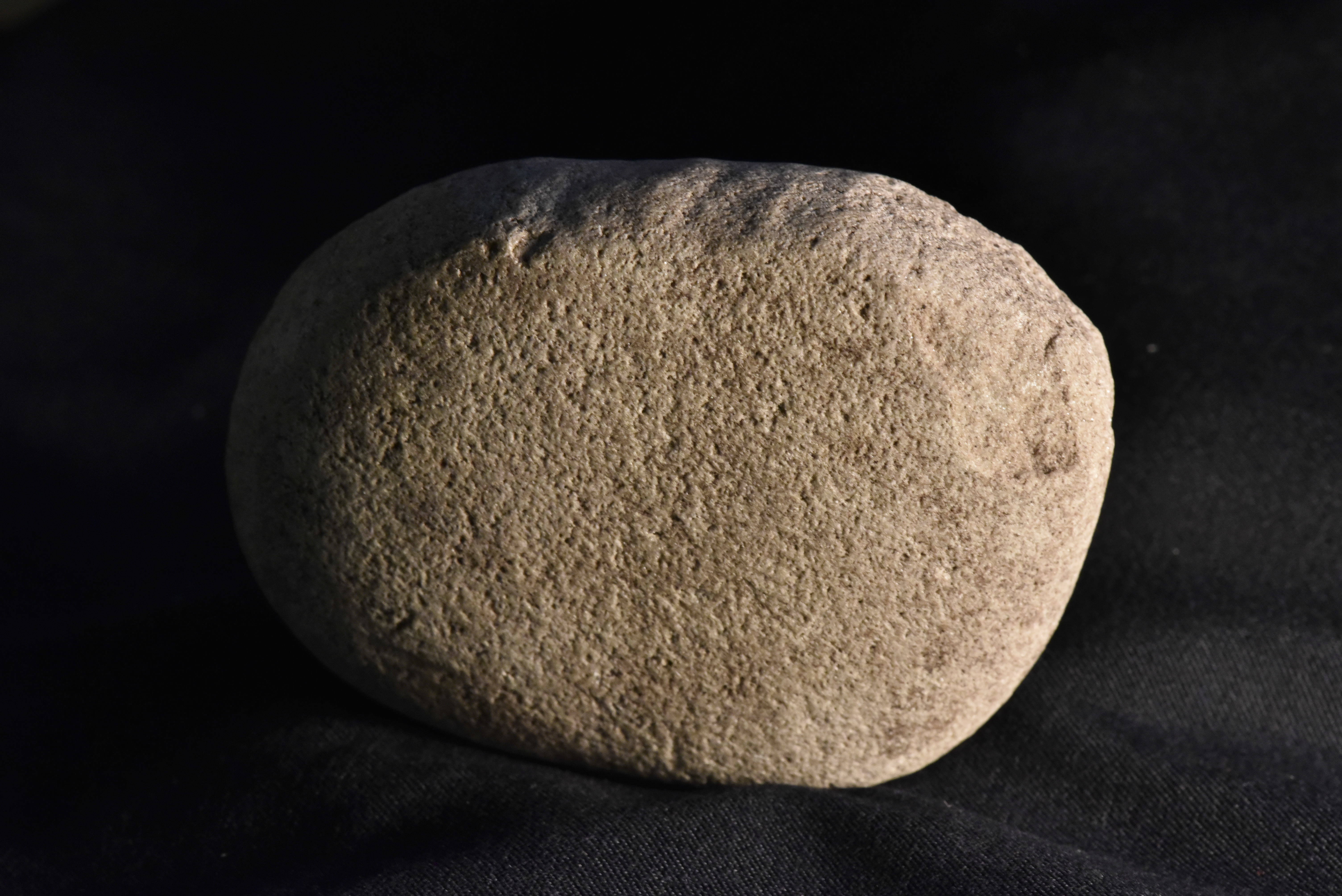 A stone that may have been used for straightening an arrow shaft