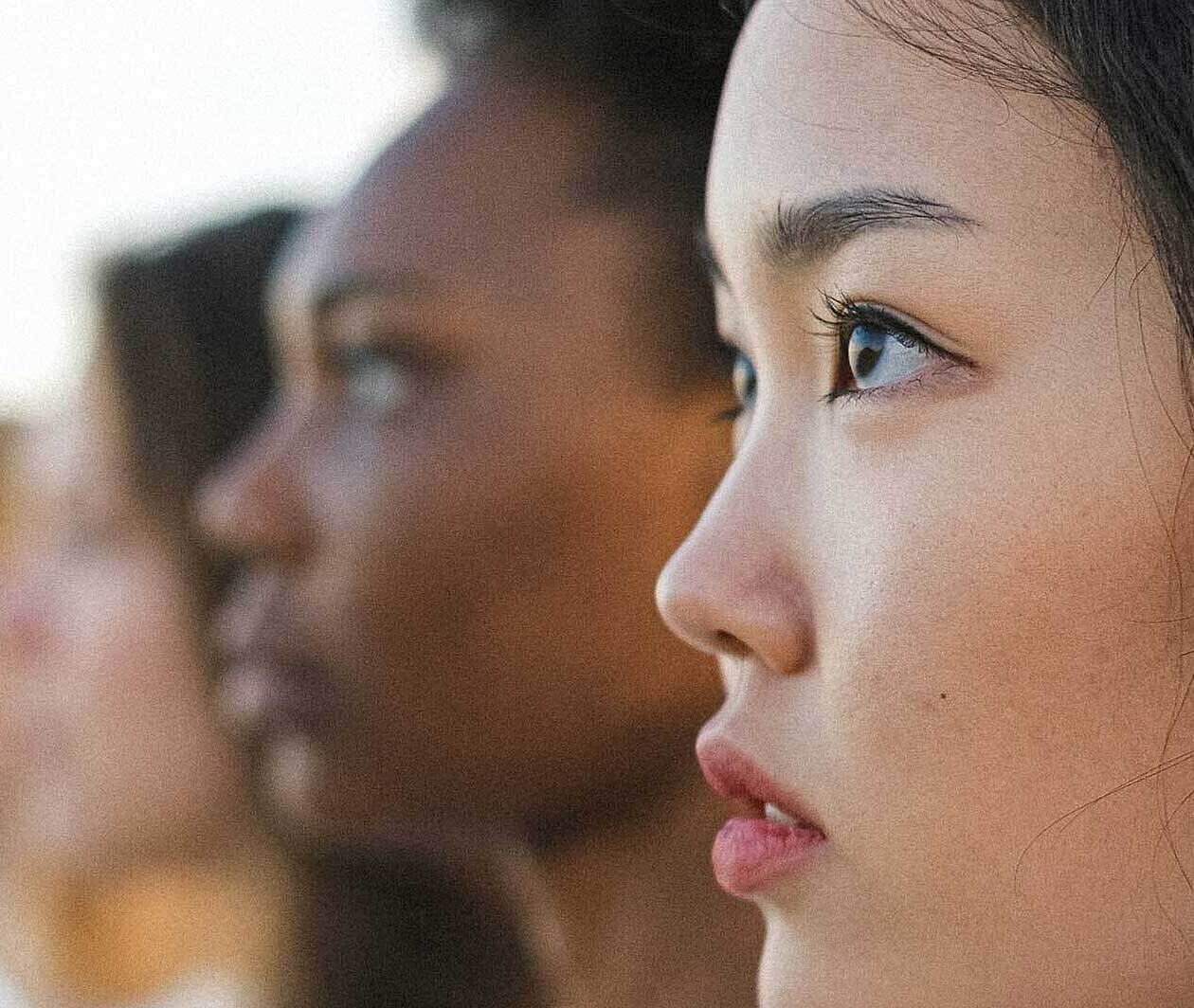 Profiles of women of various ethnicities  looking forward  