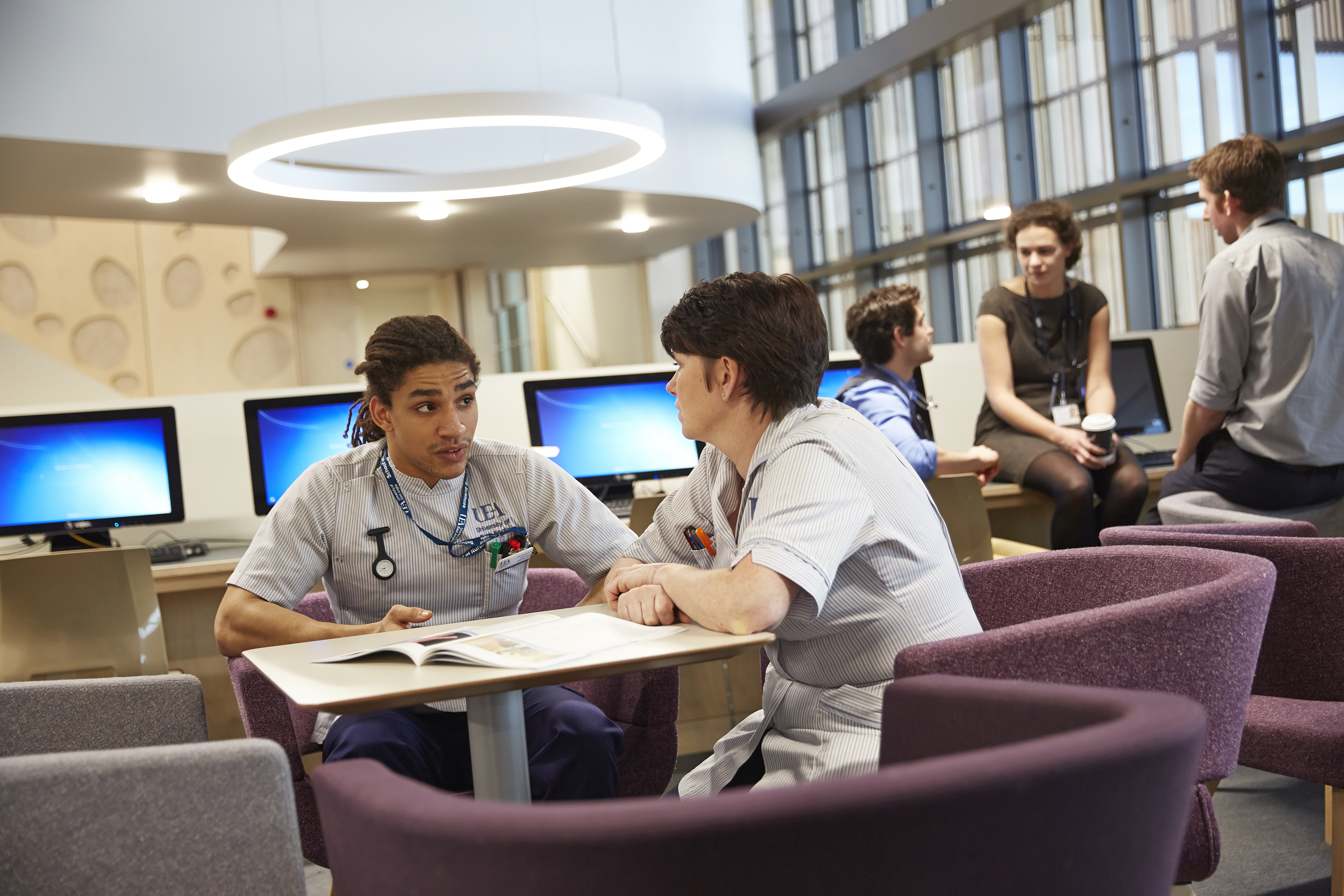 Nurses chatting in a reception area