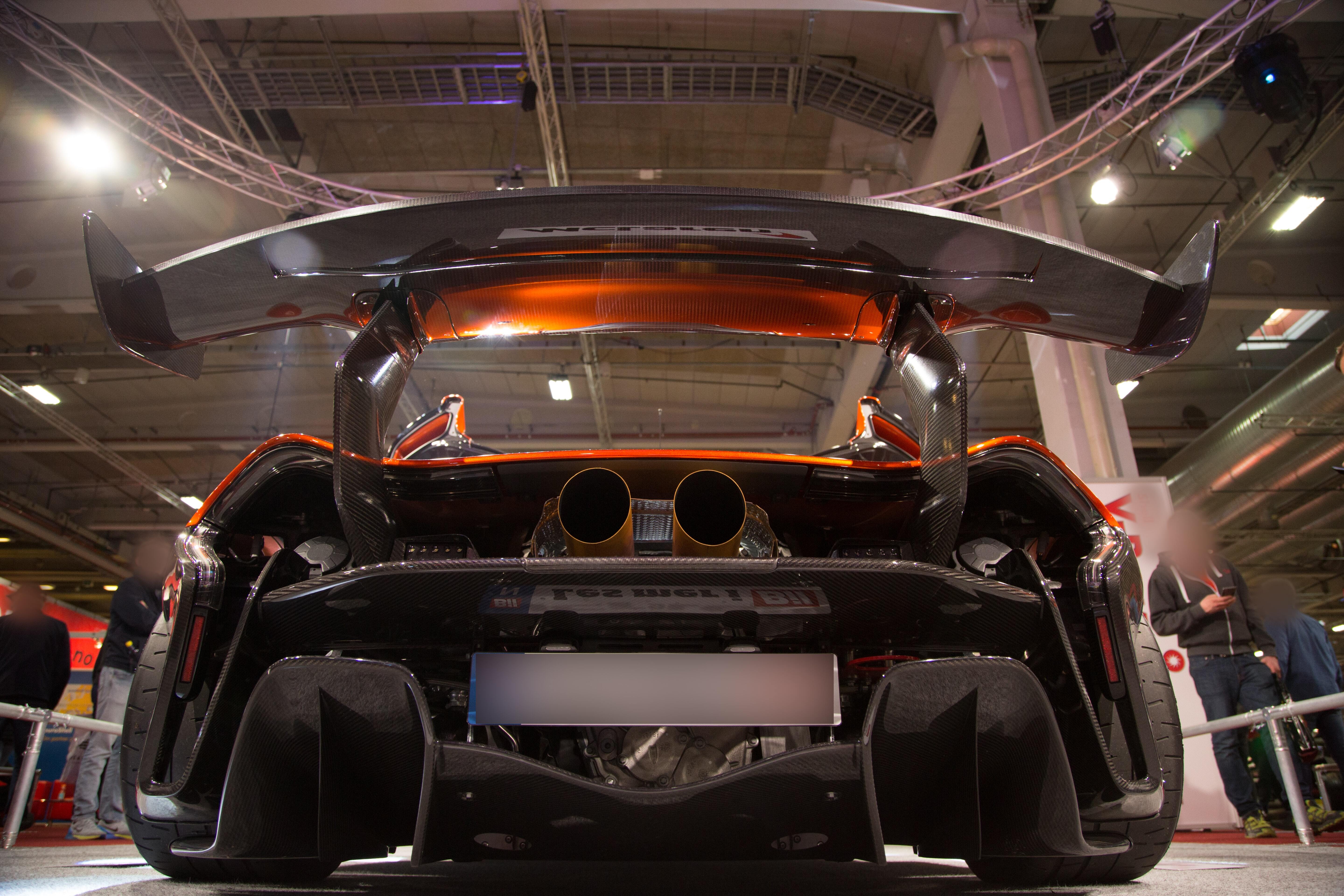 Black and red car in a factory floor