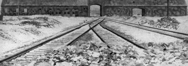 A black and white photograph of Auschwitz