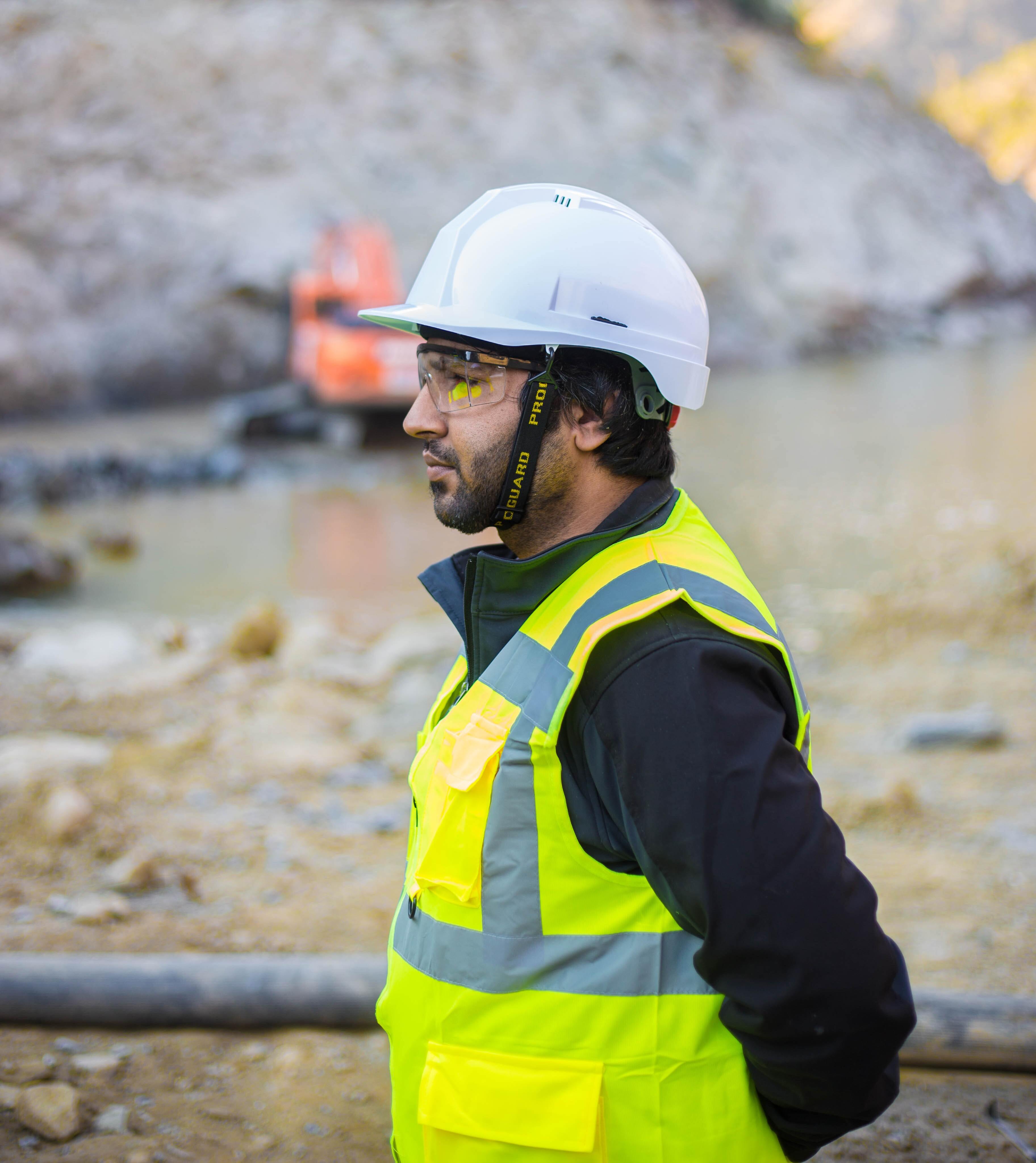 a man on a building site in hard hat