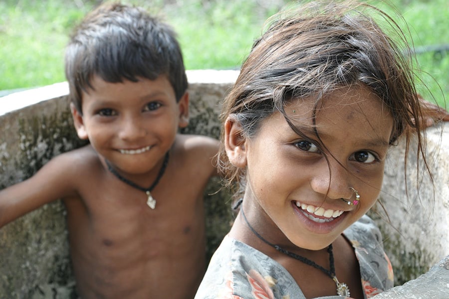 Boy and girl smiling at camera