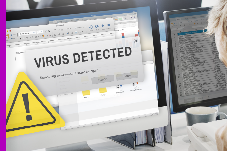 Photographic image of a computer screen with a notification saying Virus Detected