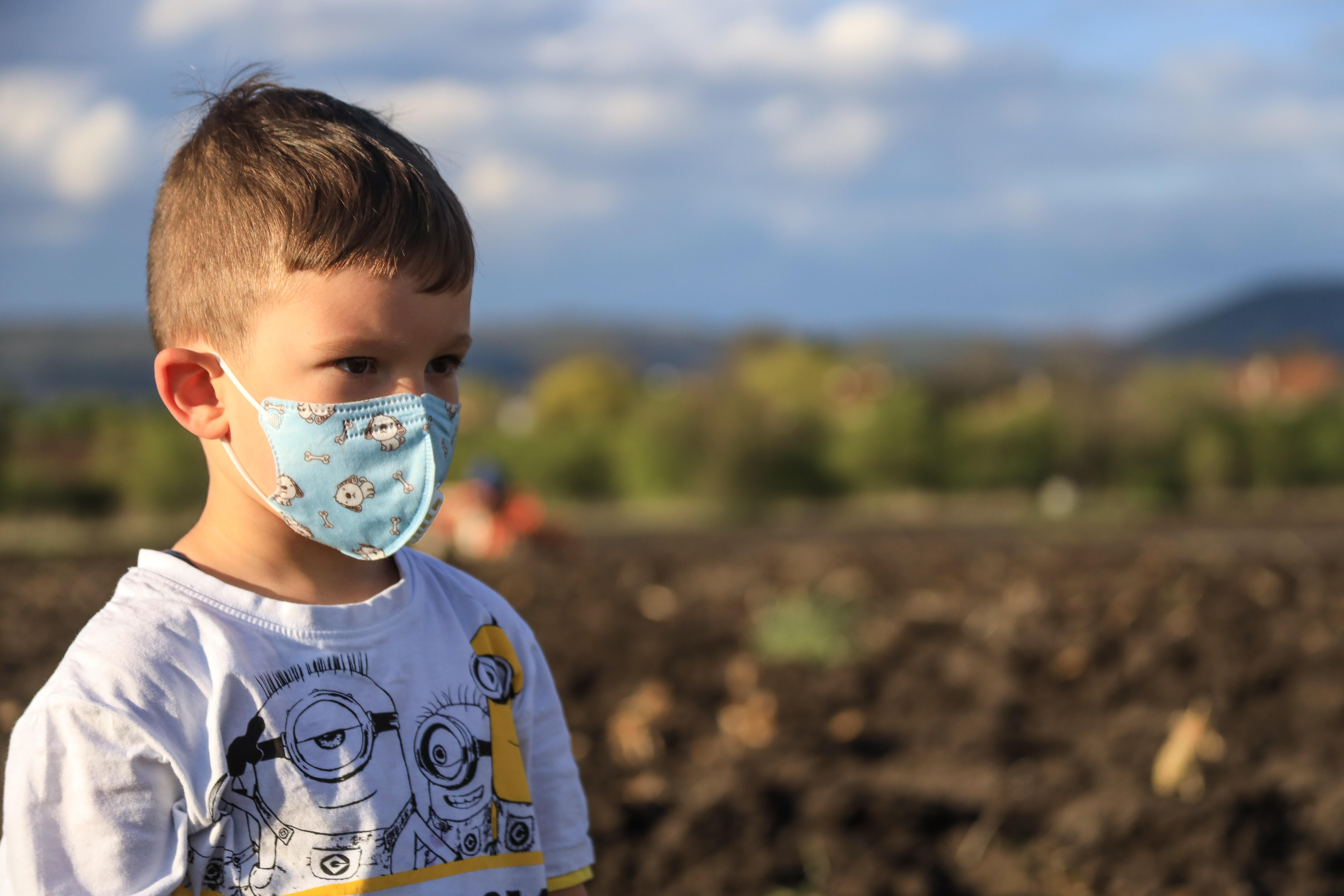 Young boy wearing a face mask