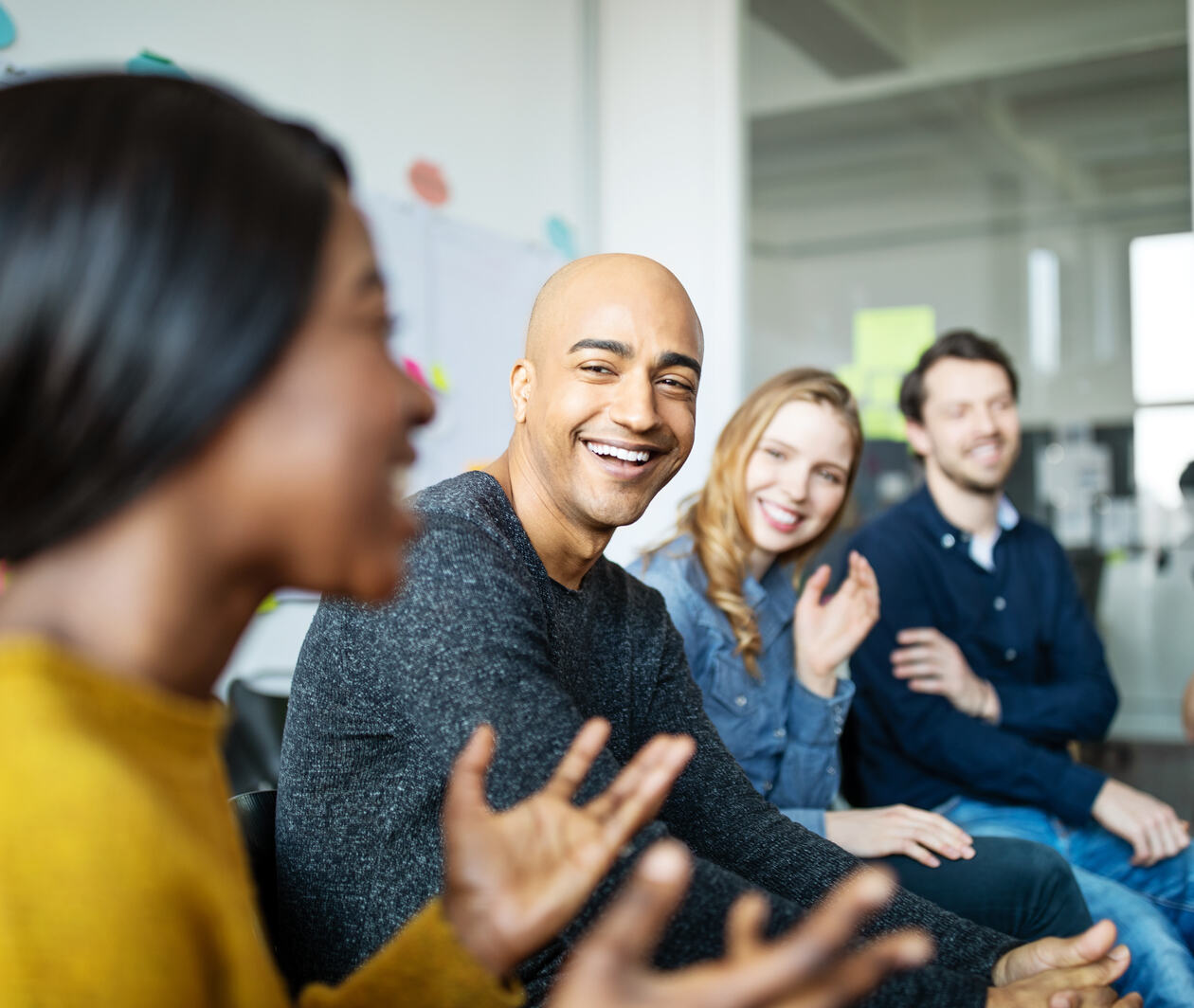 Group of diverse business people talking in a meeting. Business team smiling during a meeting.