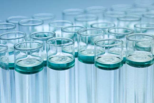 A cluster of experimental test tubes filled with liquid