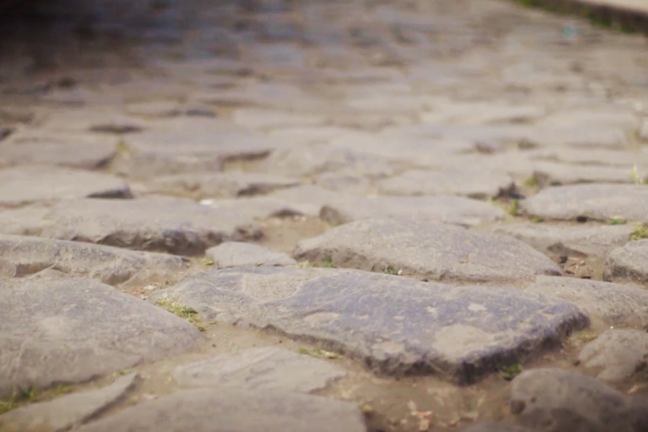 Grey large basalt stones laid out in a irregular pattern.