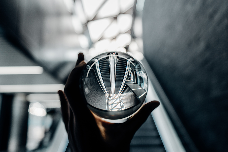 Looking though glass ball up escalators