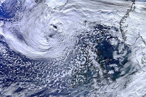 Weather: a satellite image of clouds above the earth“>
                 </div>
                 <div>
                  <div class=