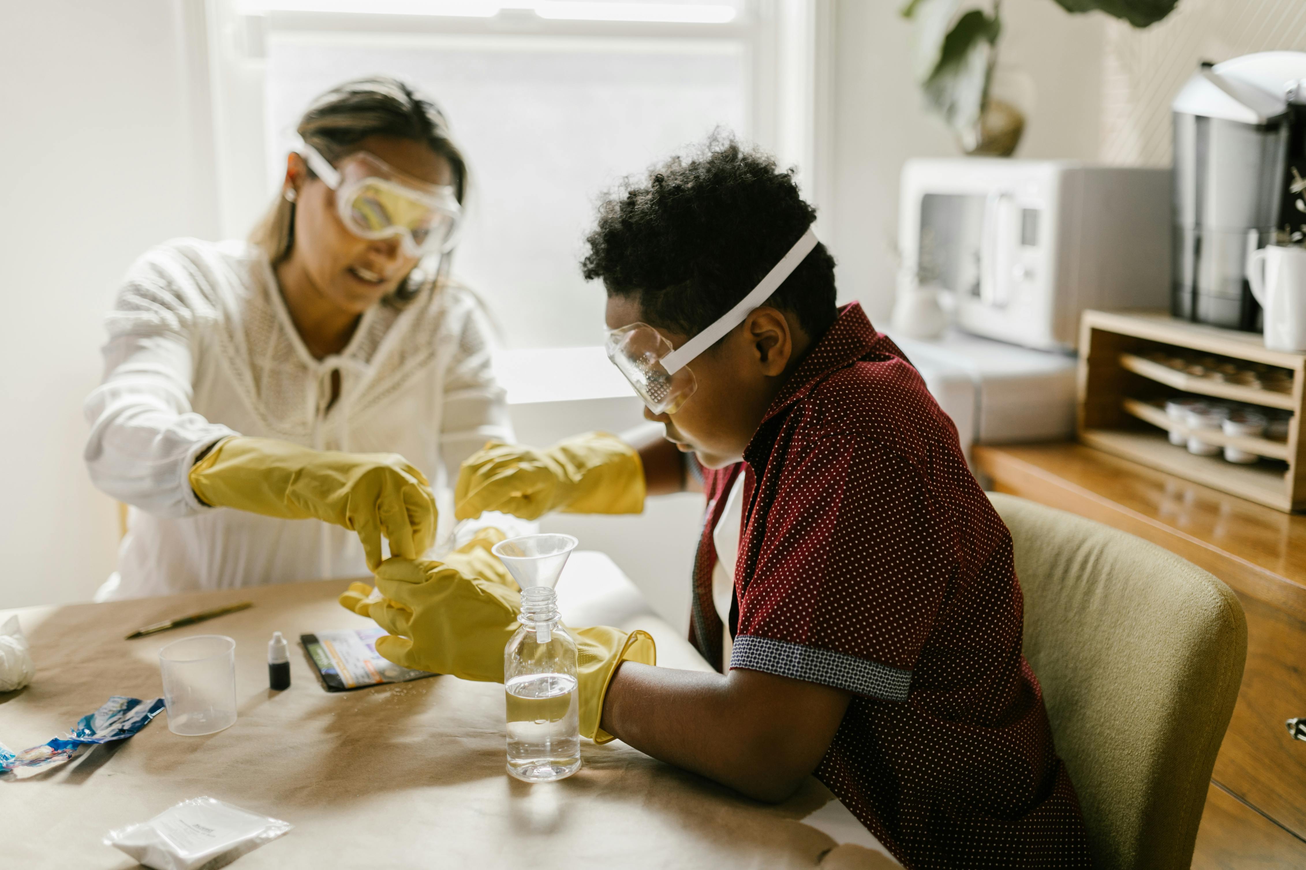 Asking different questions can change the outcome. Two students conducting a science experiment