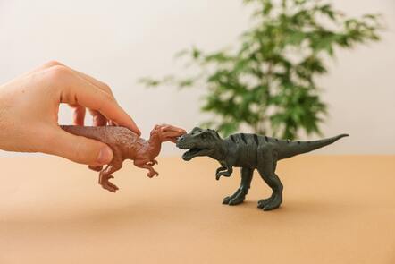 Two models of dinosaurs fighting.