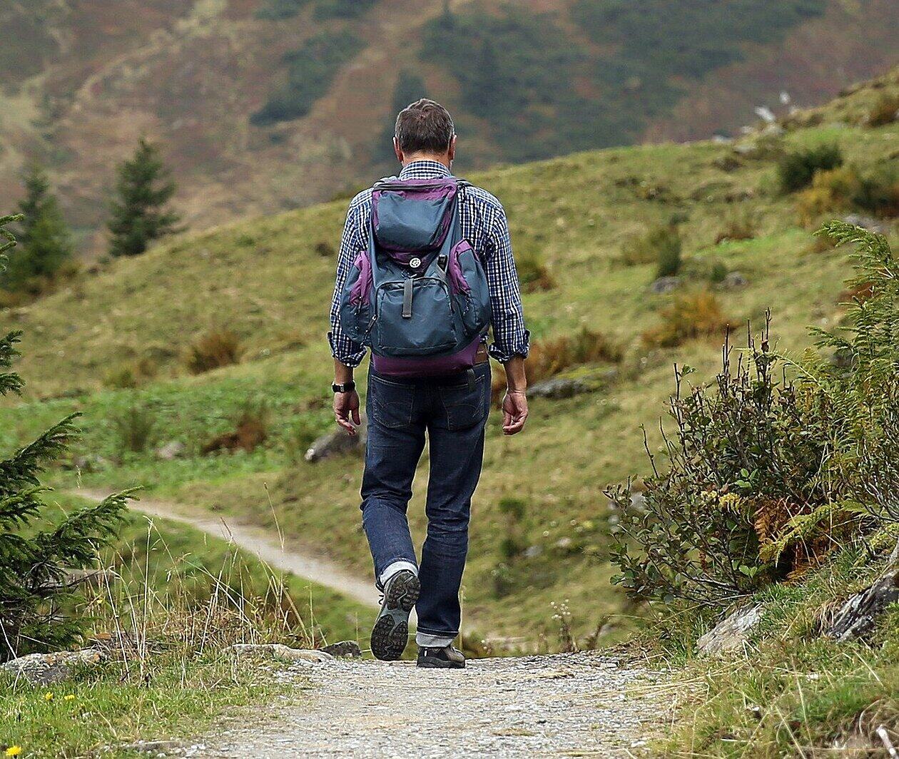Photo of a man walking in the countryside