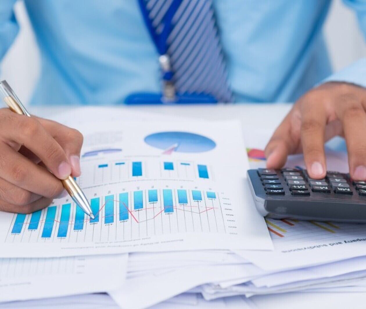 A person calculating costs