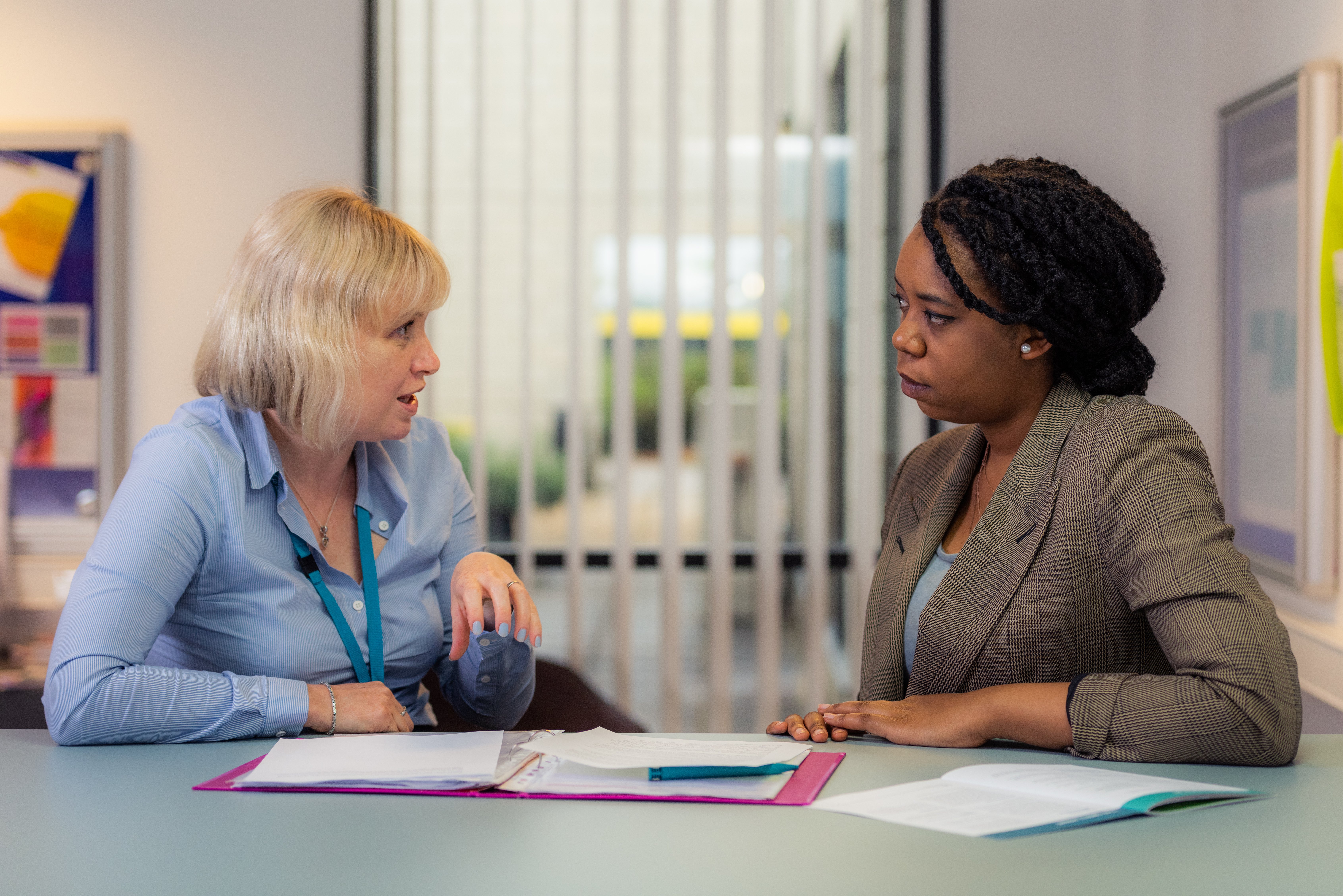 Student and tutor sat talking