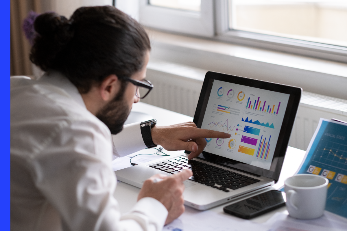 Man looking at a dashboard of monitoring software.