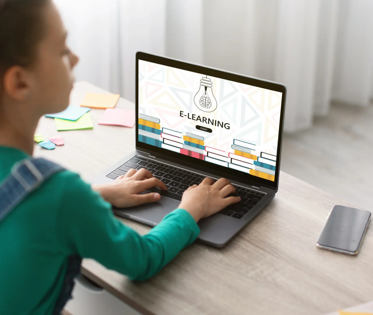 Teen Schoolgirl Using Laptop Computer At Home For Online Education.