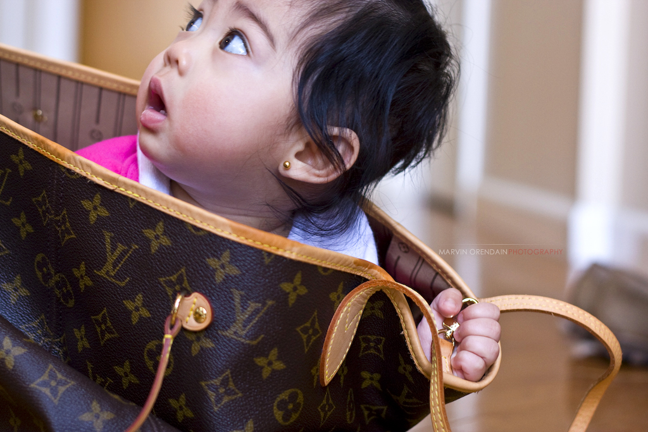 Baby in a designer bag