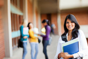 A young, confident student at a university campus.