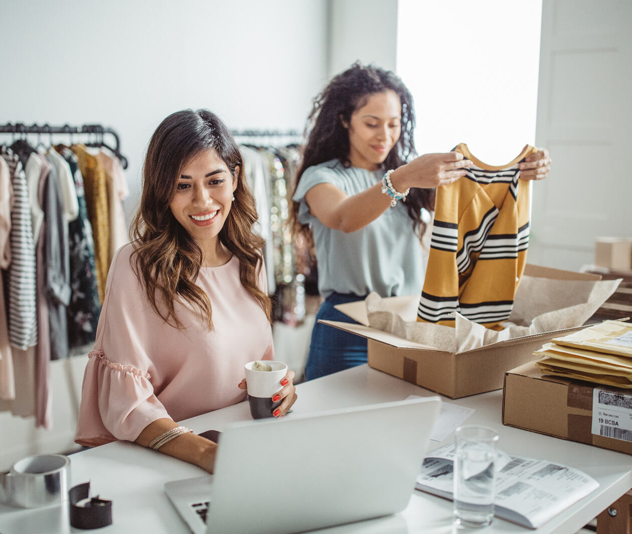 Two people working in a clothes business