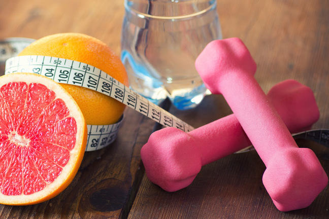 Citrus fruit and dumbbells.