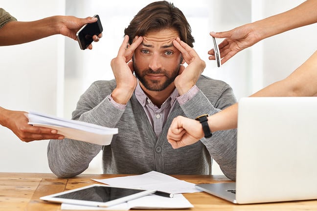 A man overwhelmed by his business