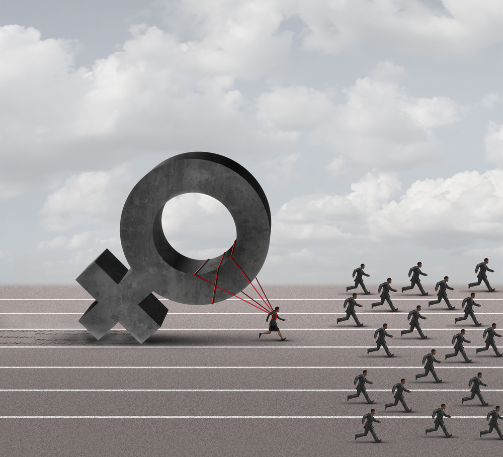 The image shows lots of men and one woman in a running race. The woman behind the men as is tethered to the symbol for female which is holding her back.