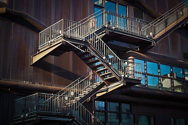 A finely structured external staircase going up several levels