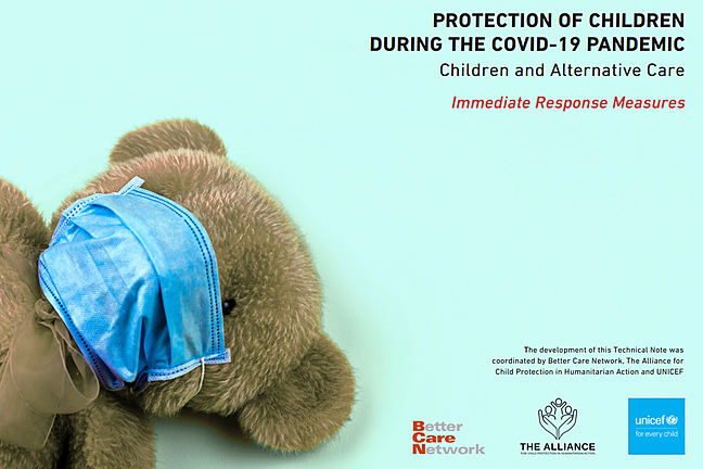 Picture of a brown teddy bear wearing a face mask