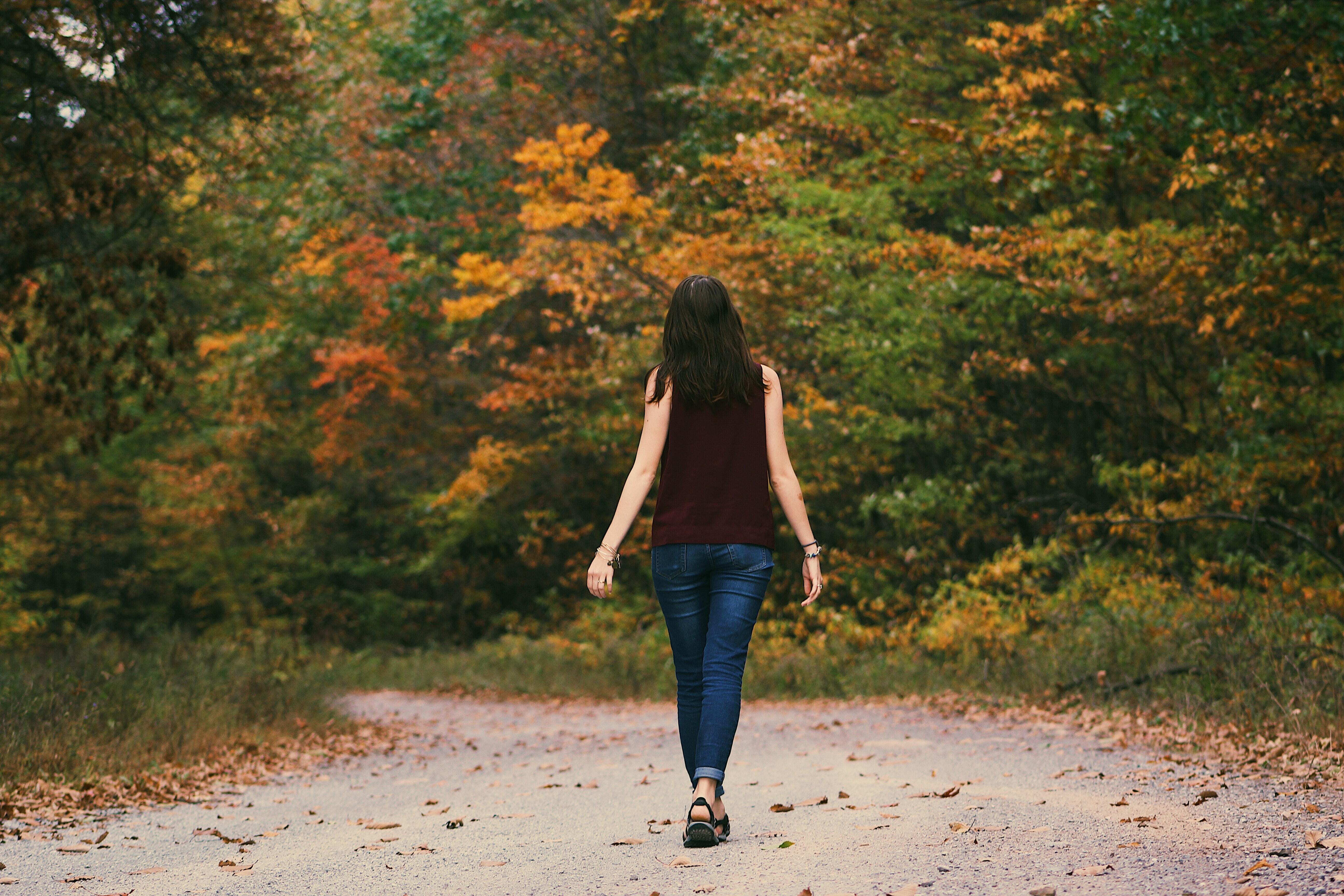 a women walking in the woods