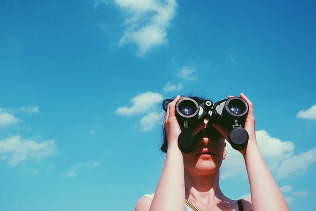 Binoculars to signify the reflective journey