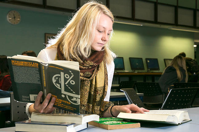 A student consulting various books