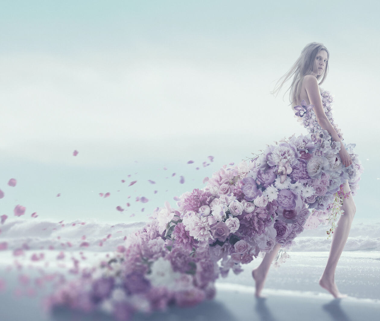 Woman wearing a dress made of flowers