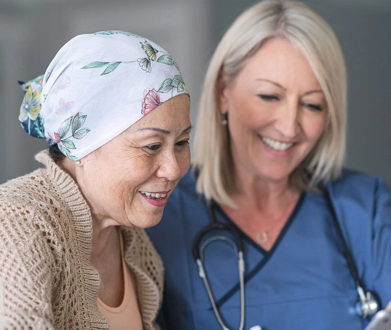 An elderly cancer patient and a medical practitioner